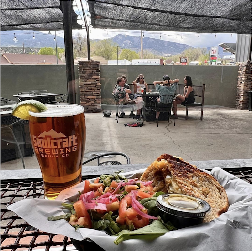 draft beer and sandwich on table overlooking durango colorado